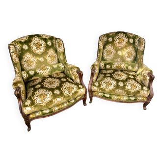 Pair of large old wingback armchairs