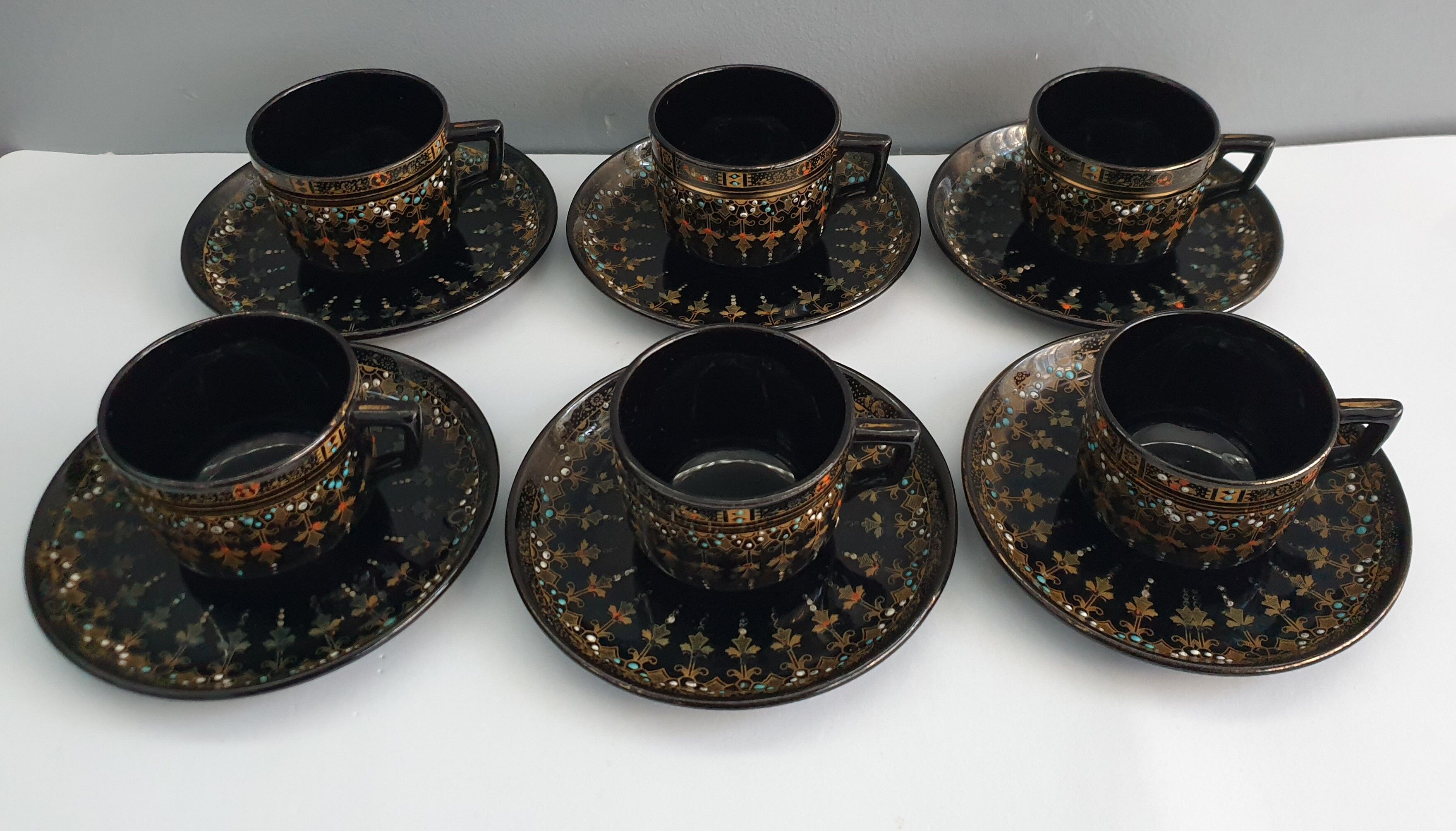 Six coffee cups and saucers in English earthenware Gibson & sons