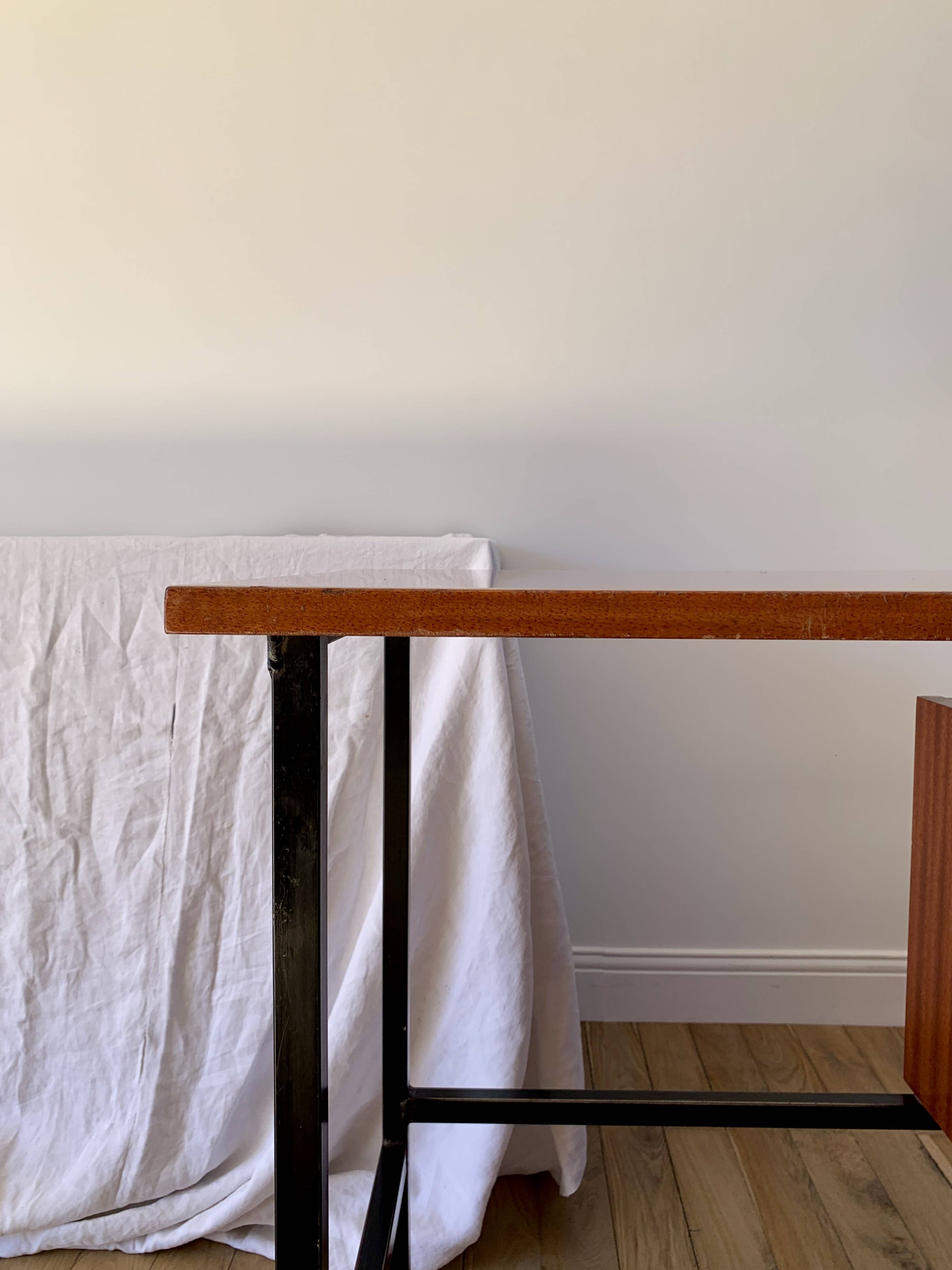 lacquered wood desk and black steel legs design from the 60s and 70s