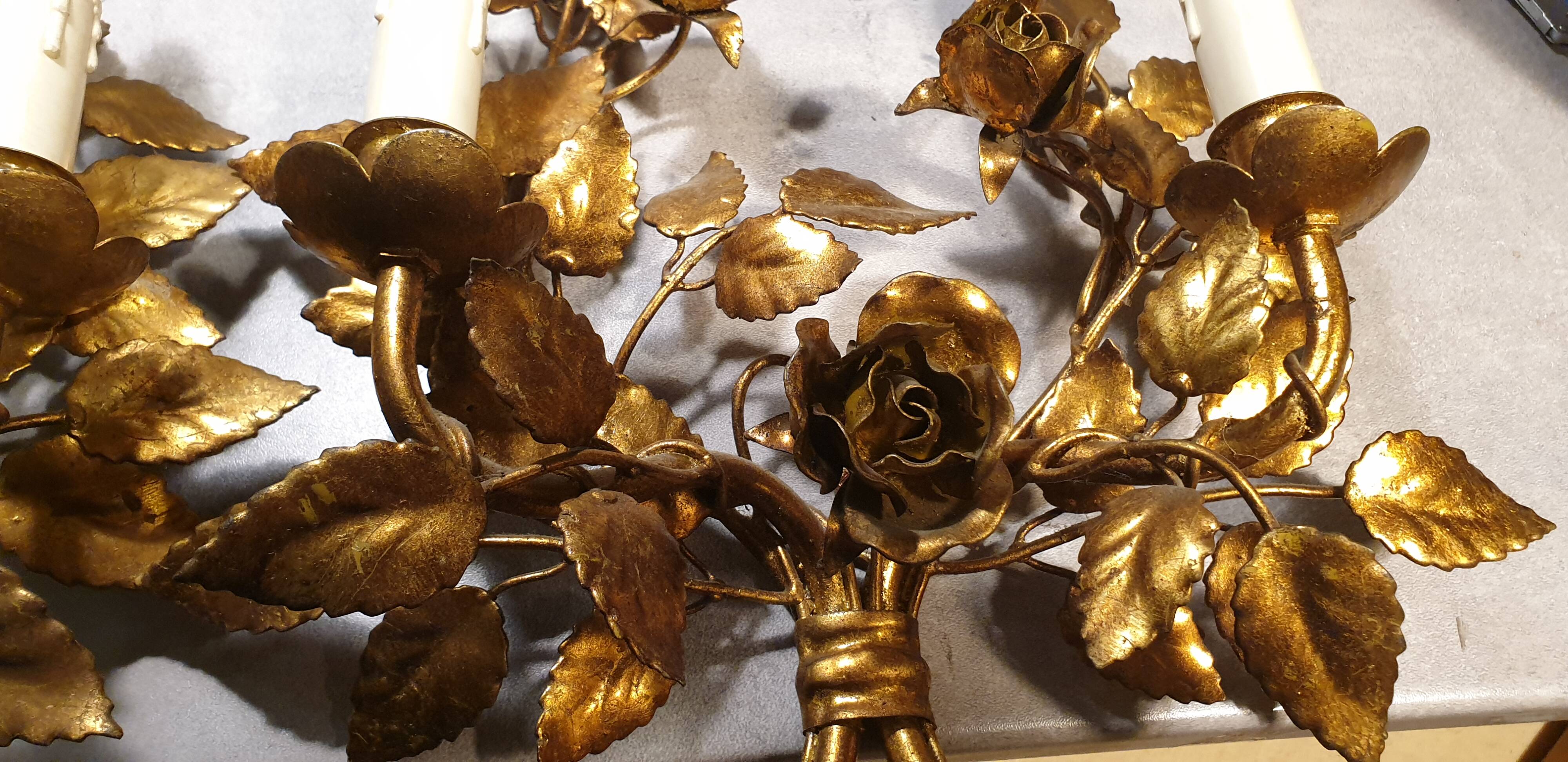 Pair of gold metal wall lights
