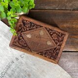 Carved wooden box with brass inlay