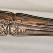 I030 Sugar tongs in silver-plated rock – Louis XV style