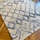Berber cream carpet with blue patterns