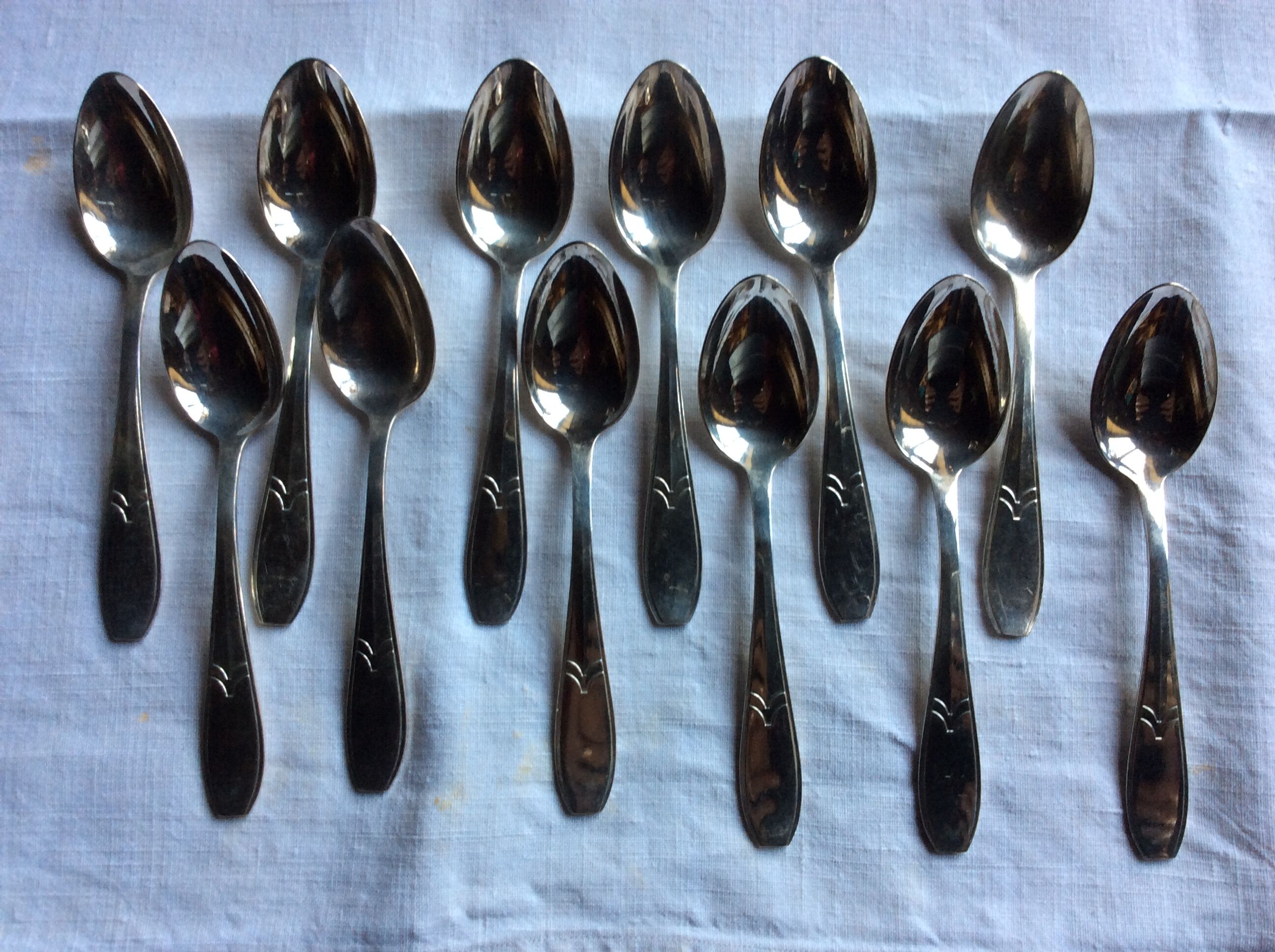 12 small art deco spoons, silver metal
