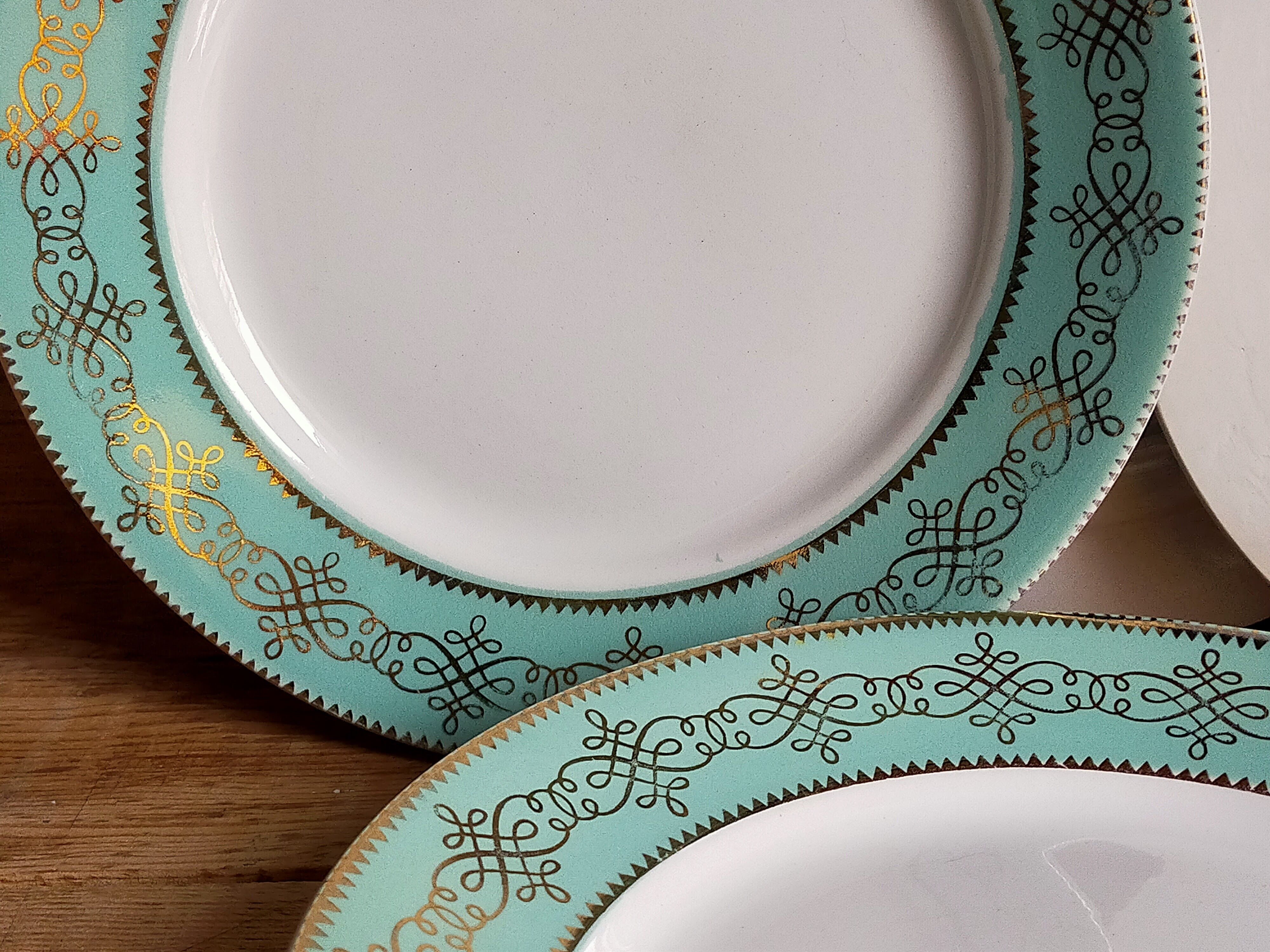 Six plates of vintage Badonviller earthenware with gold frieze