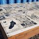 Table à manger en teck avec plateau illustré
