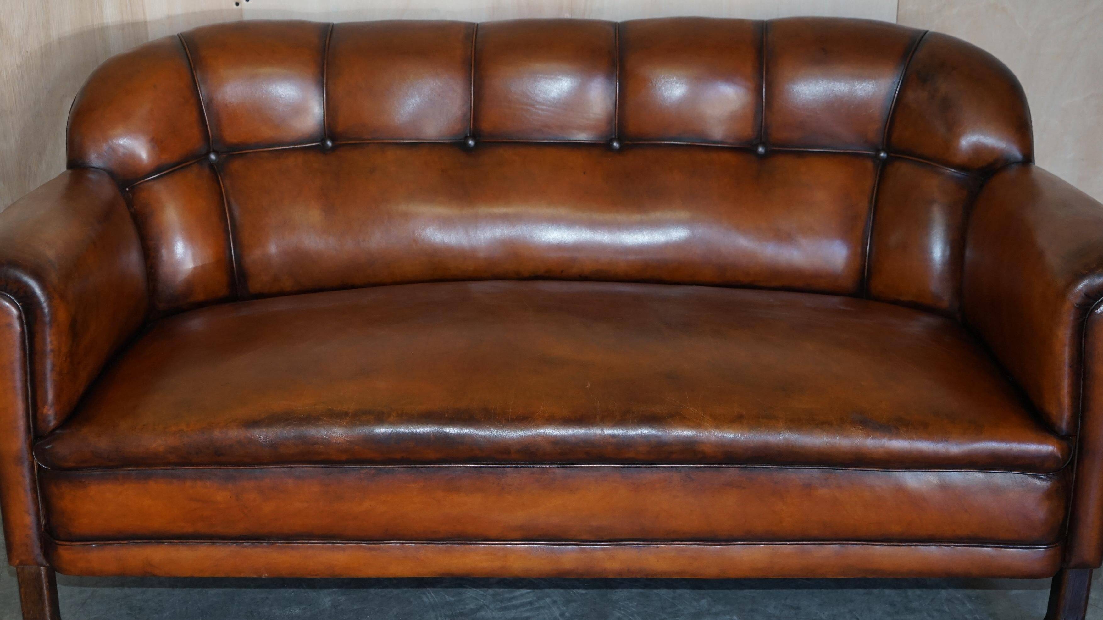 Victorian Chesterfield leather canapé with oak lion claw feet.