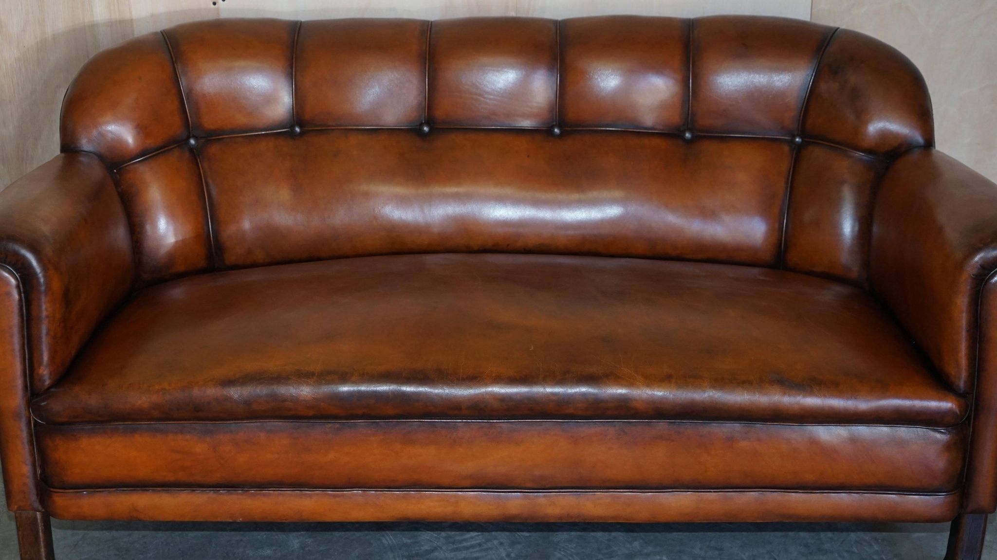Victorian Chesterfield leather canapé with oak lion claw feet.