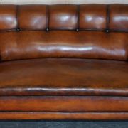 Victorian Chesterfield leather canapé with oak lion claw feet.