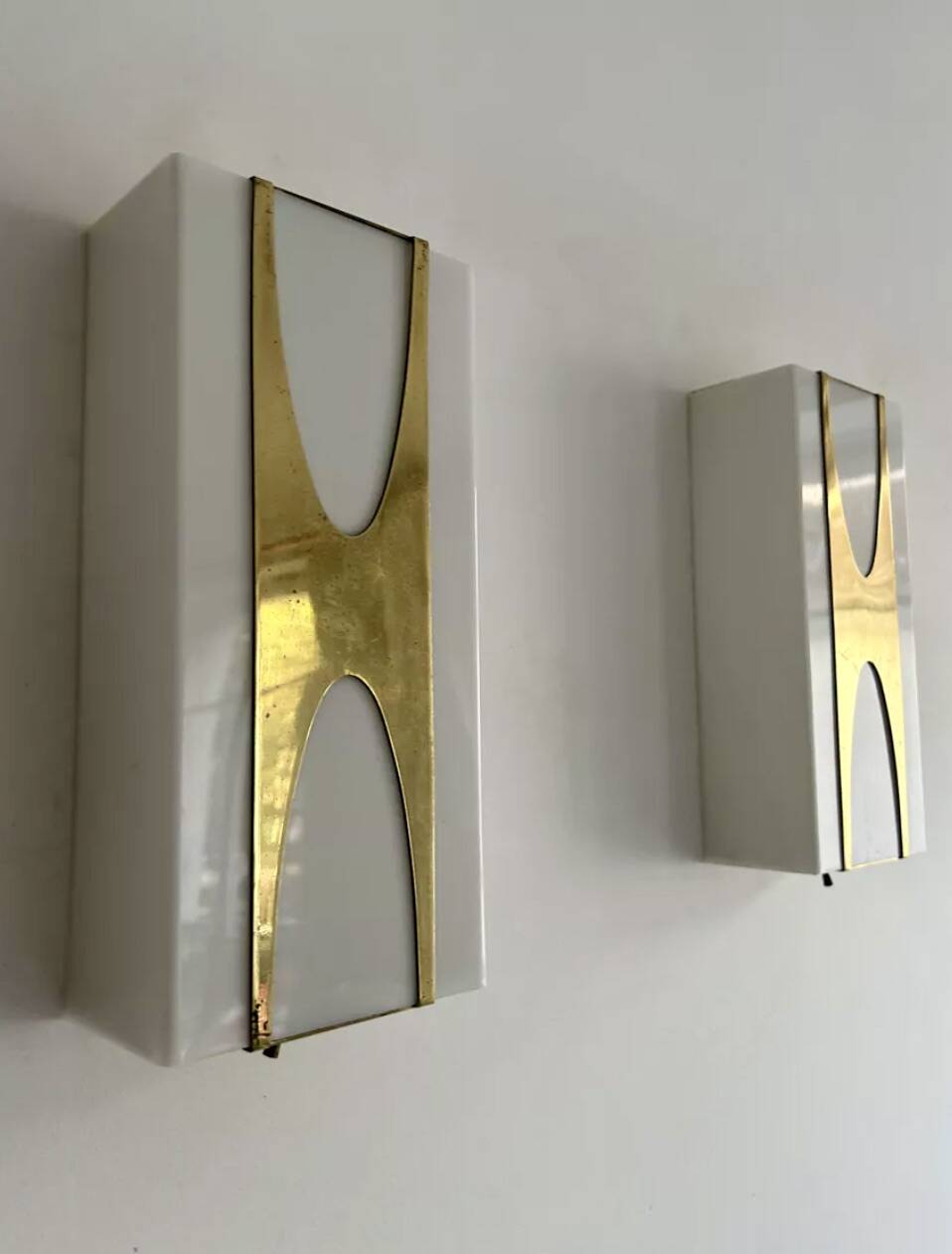 Pair of Loewy wall lights for Hilton, brass and Perspex, France 1965