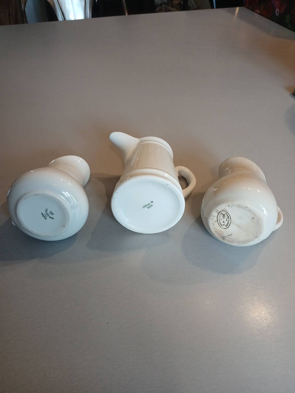 3 small antique porcelain pitchers/milk pots