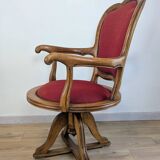Vintage captain's chair in wood and garnet fabric — a seat with character