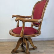Vintage captain's chair in wood and garnet fabric — a seat with character