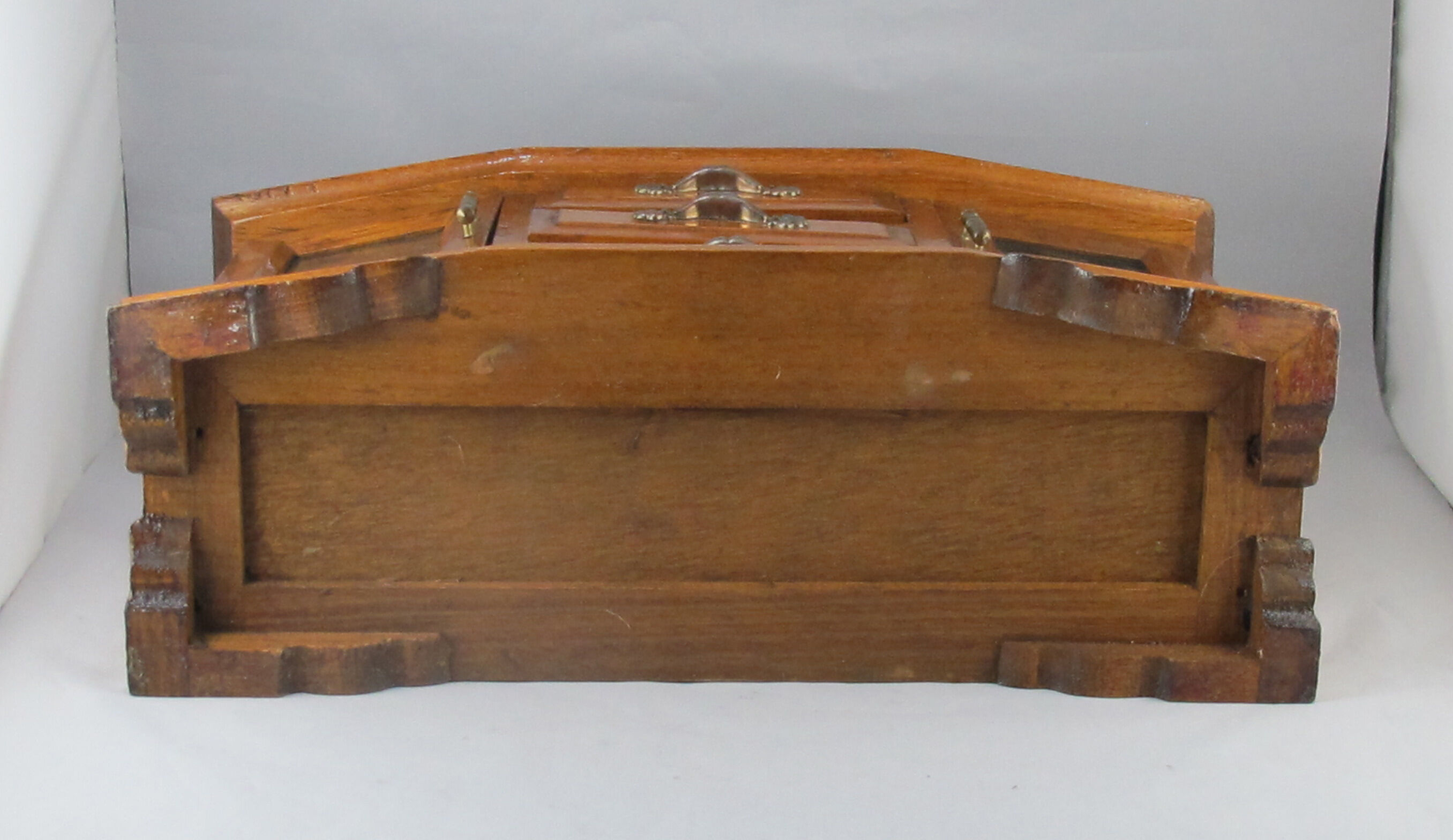 Wooden jewelry box in the shape of a chest of drawers