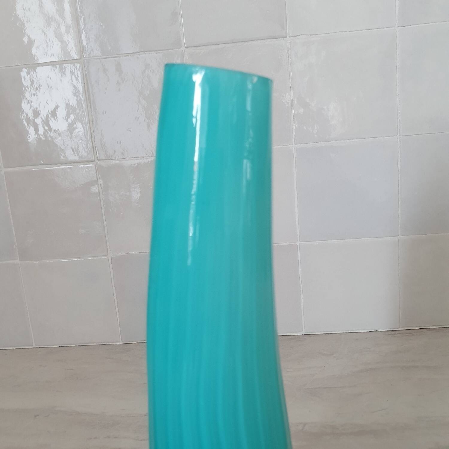 Curved turquoise blue blown glass soliflore vase