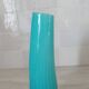 Curved turquoise blue blown glass soliflore vase