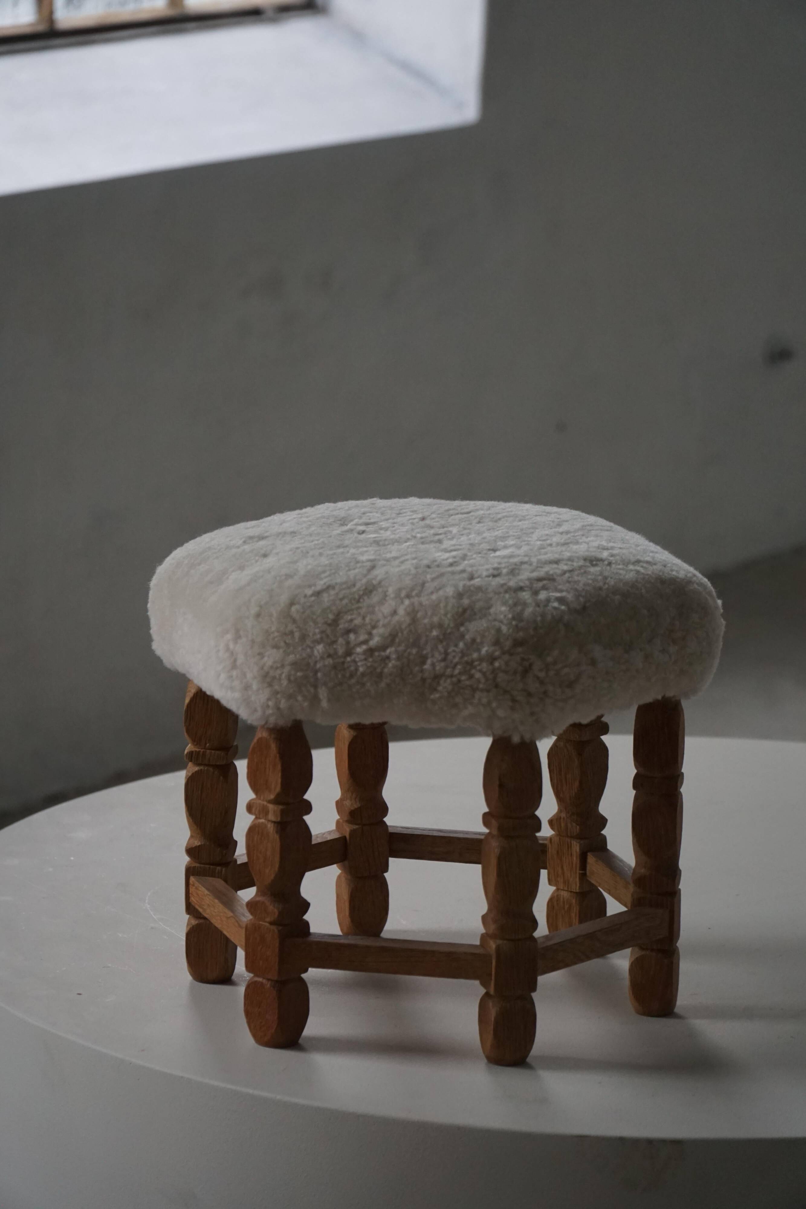 Mid-century Danish hexagonal oak stool with shearling lamb wool upholstery, 1950.