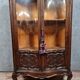 Curved library with two walnut doors, in Louis XV style.