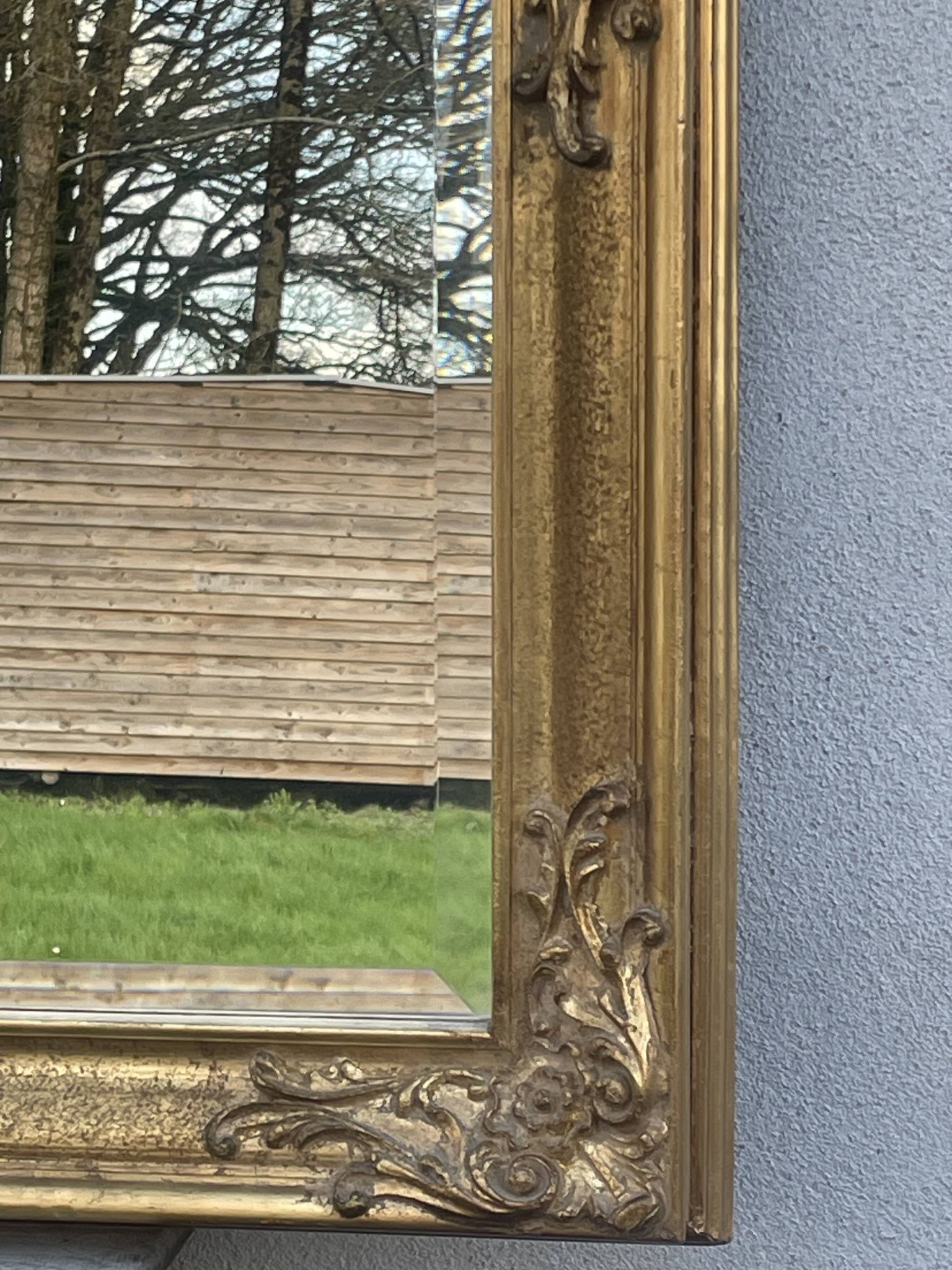 vintage bevelled mirror in rectangular shape, stucco and gilded wood in Louis XV baroque style