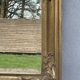 vintage bevelled mirror in rectangular shape, stucco and gilded wood in Louis XV baroque style