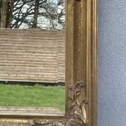 vintage bevelled mirror in rectangular shape, stucco and gilded wood in Louis XV baroque style
