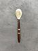 Mother-of-pearl and wood spoon