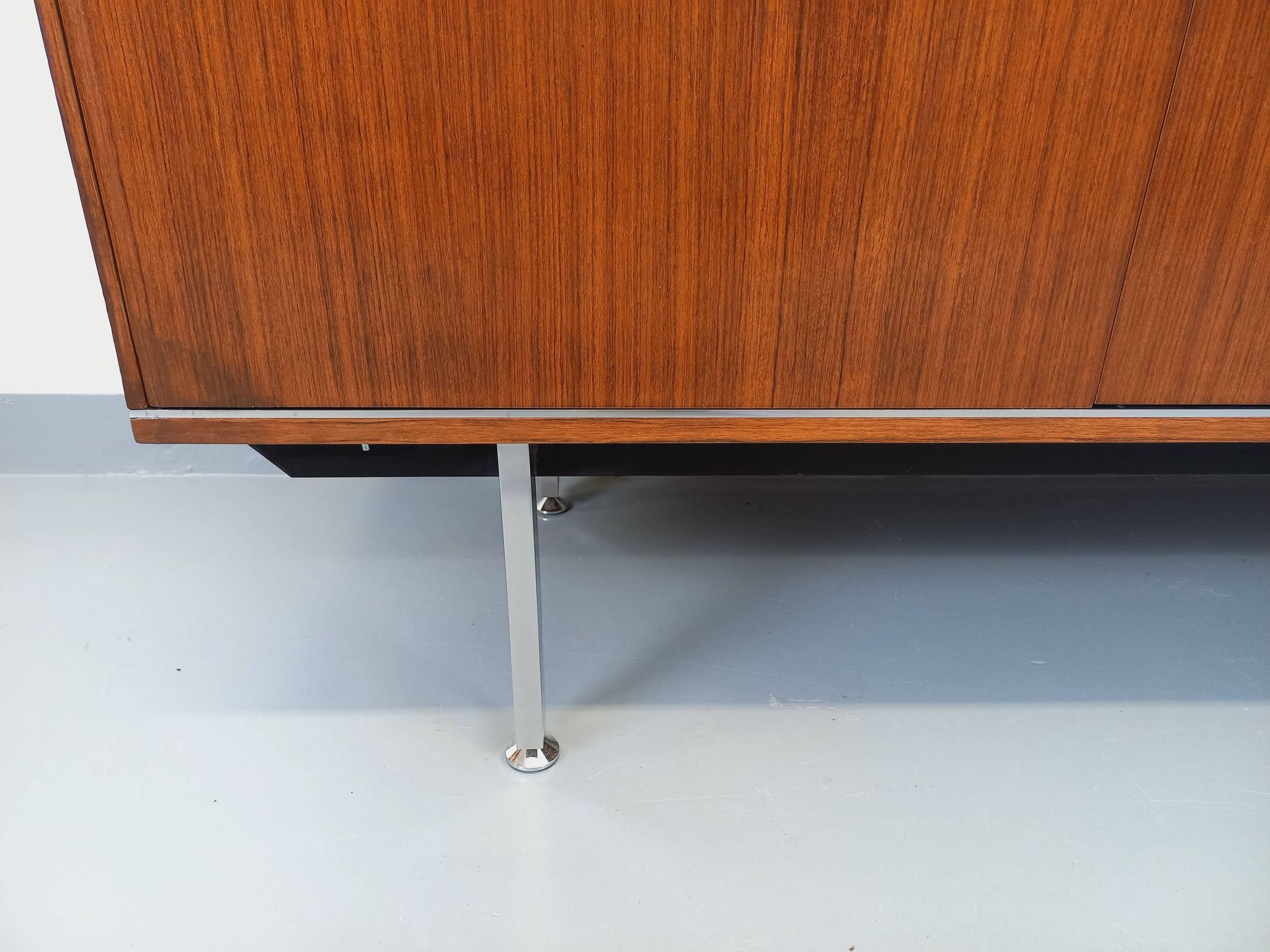 Vintage modernist enfilade in rosewood and chrome metal from the 60s and 70s.