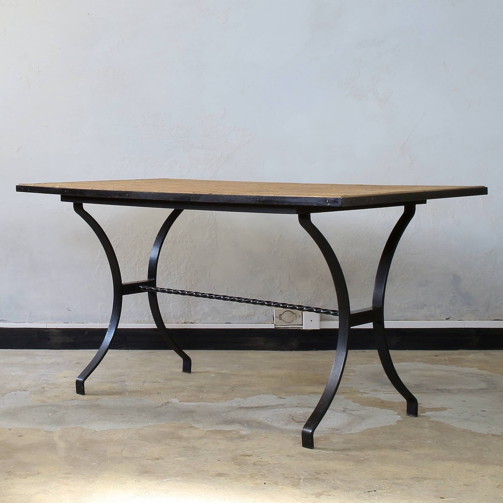 Dining table in rattan and wrought iron similar to Audoux & Minet.