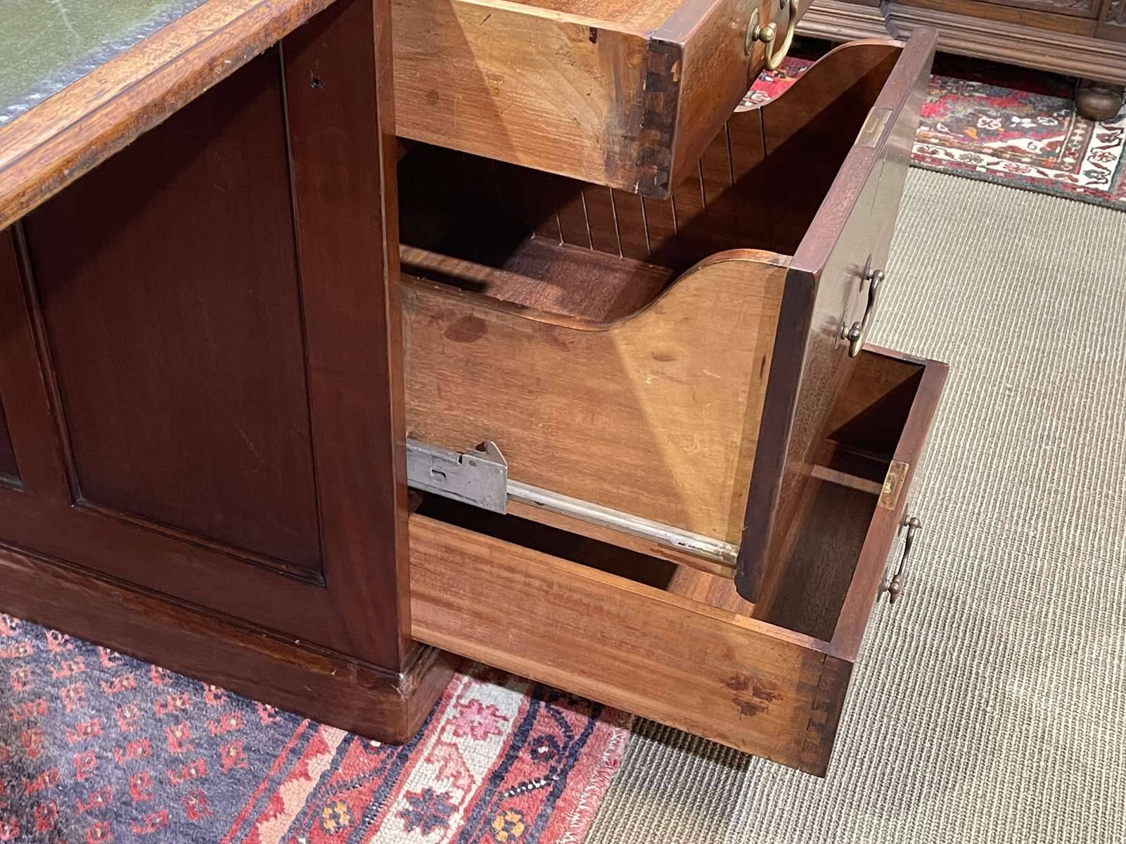 Large English flat desk in mahogany with leather top, early 20th century
