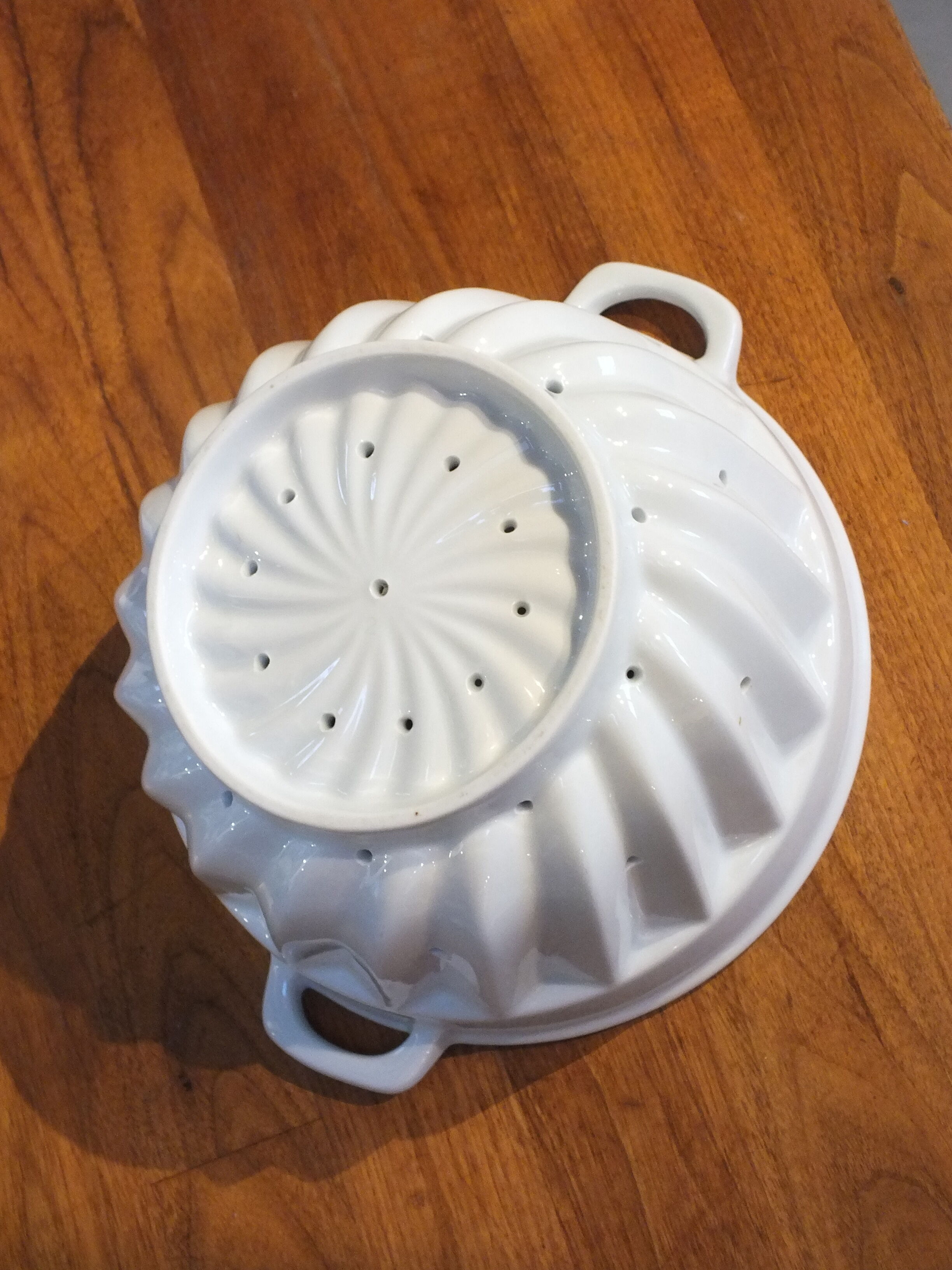 White porcelain strawberry strainer or drainer