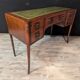 Art Deco desk in curved mahogany veneer.