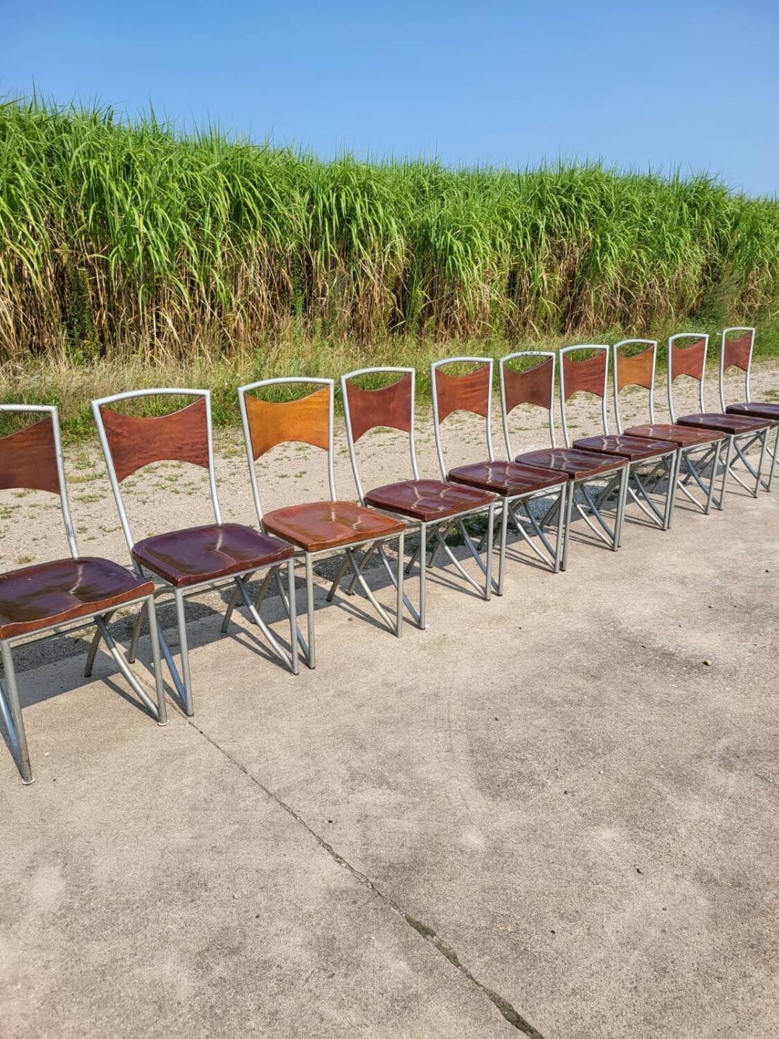 Set of 10 tubular oak bistro dining chairs in vintage industrial style.