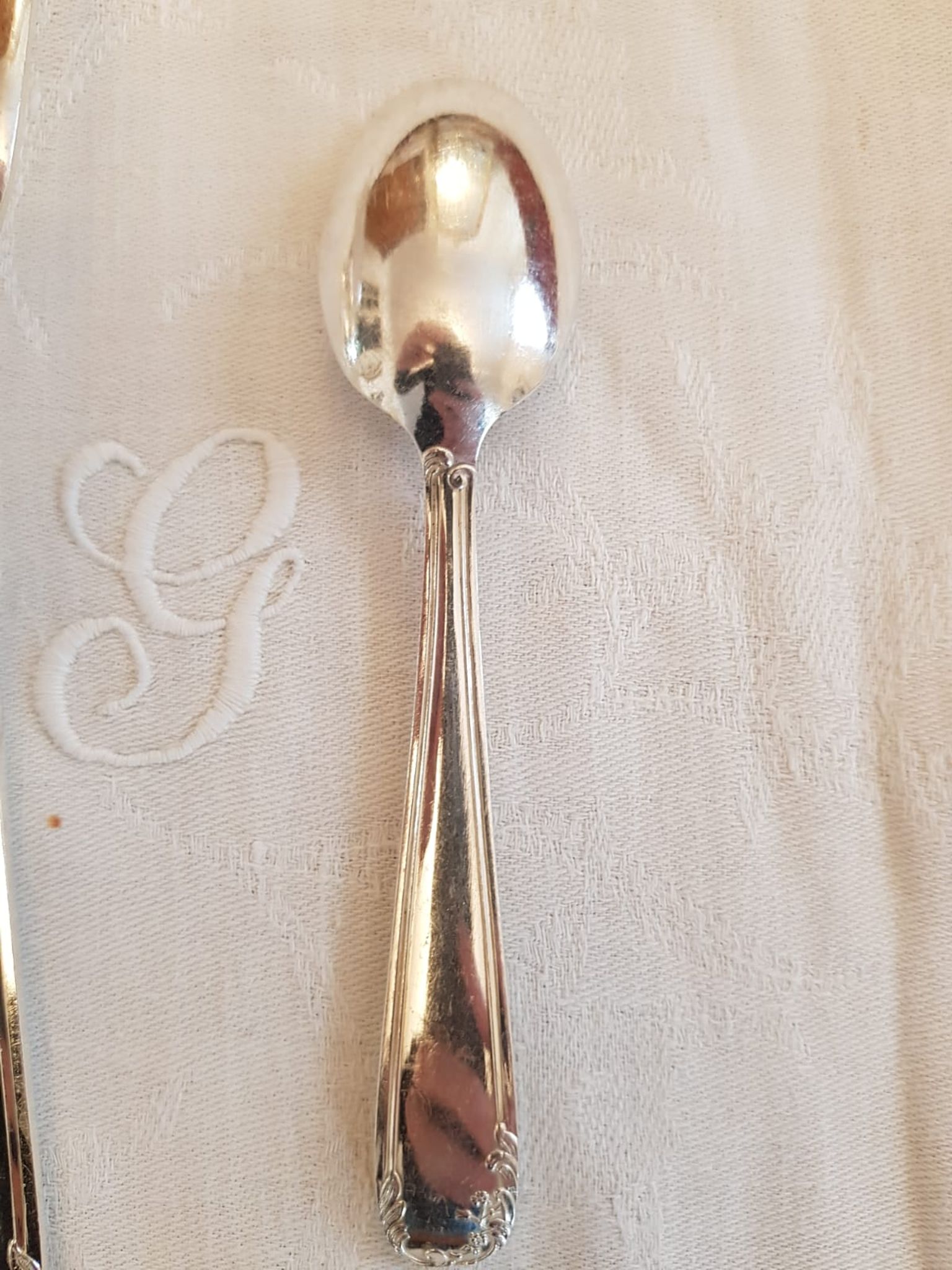 Silver cutlery set for 36 place settings and its ladle.