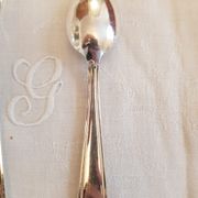 Silver cutlery set for 36 place settings and its ladle.