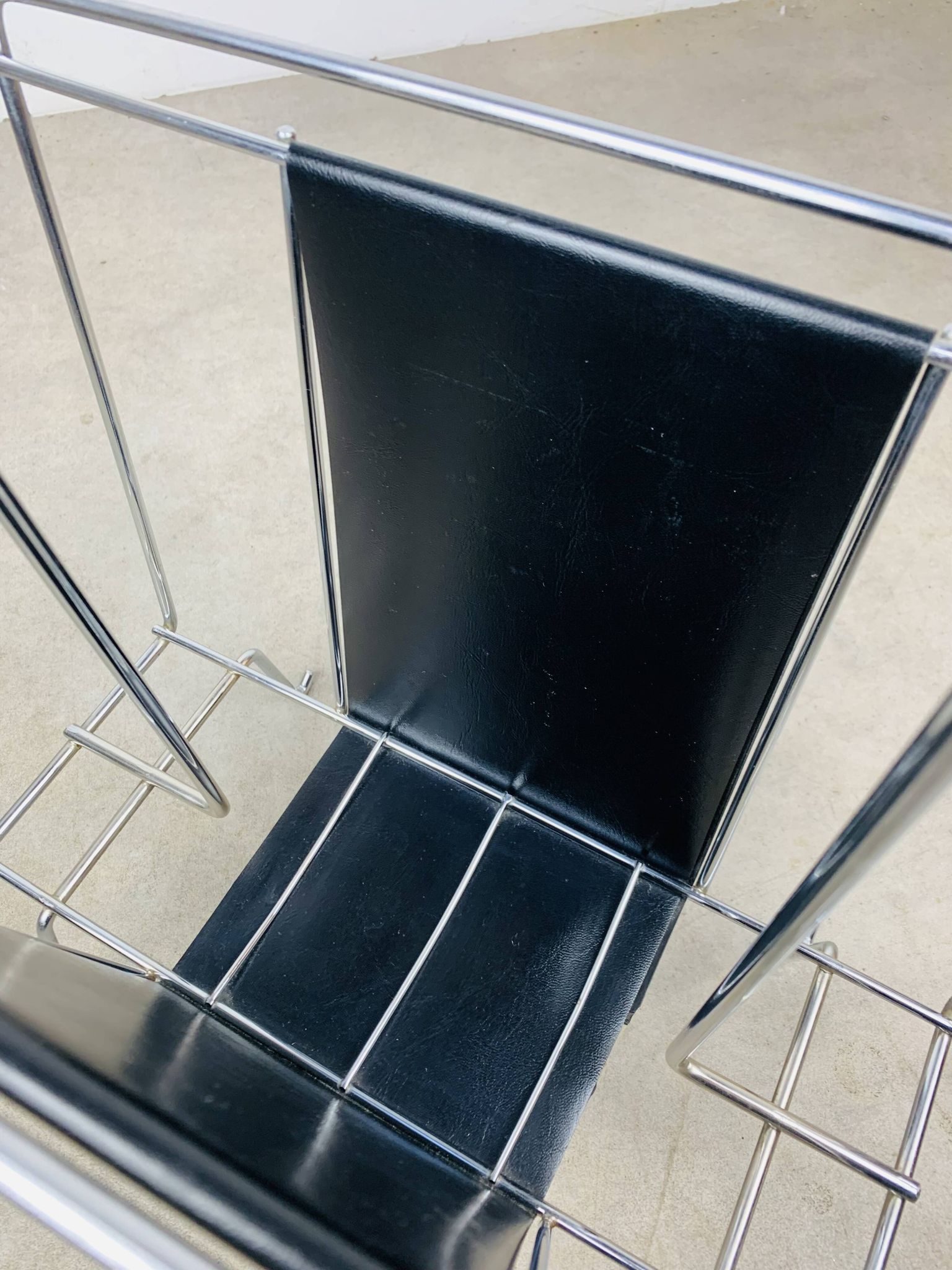Chrome and black leather magazine rack, 1970s.