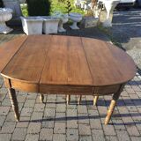 12-foot round oak table with 7 extensions / 20 people