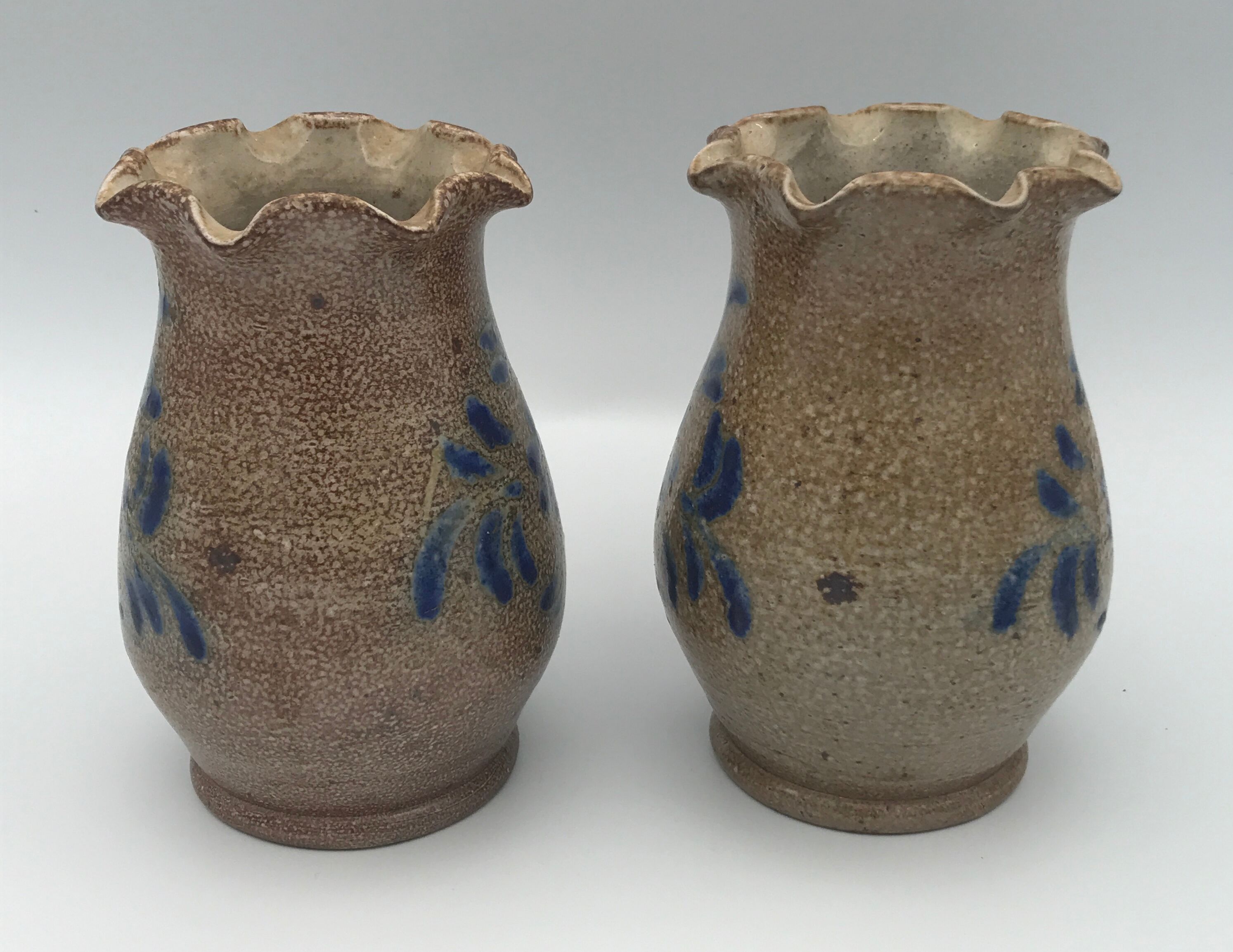 Pair of vintage pottery vases with floral decoration and glaçureau sel