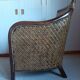 Fauteuil rotin tressé et bois exotique