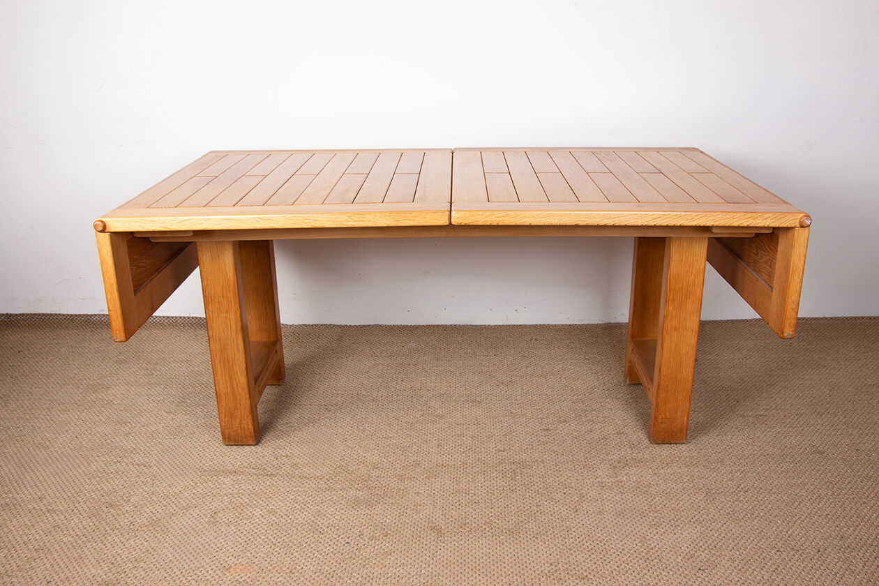 Large extendable dining table in solid oak by Guillerme and Chambron.