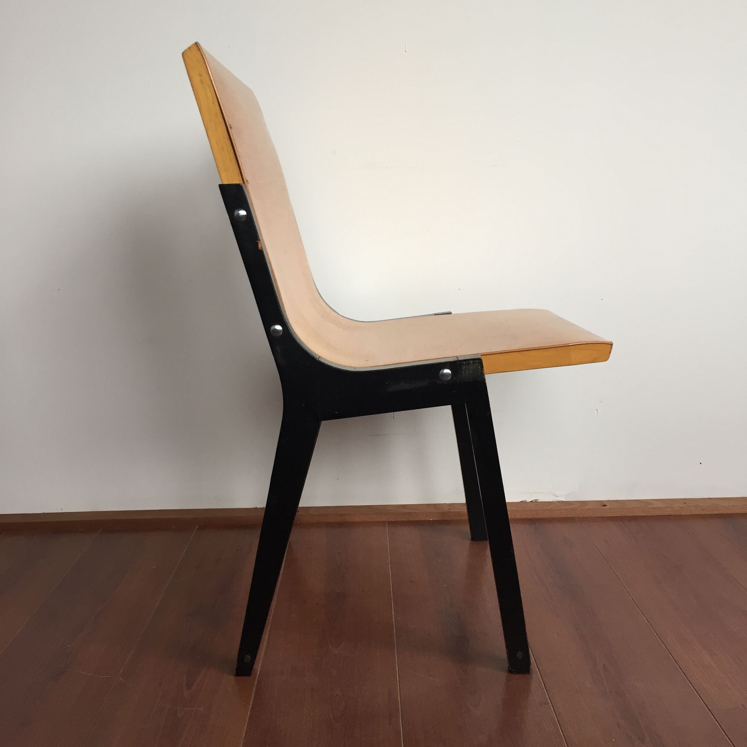 1950s church or school chairs in beech plywood and black stained wood by Roland Rainer