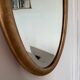 Miroir doré ovale ancien glace biseautée
