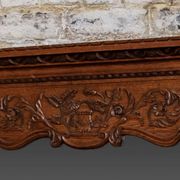 Miroir biseauté en chêne sculpté début XXème
