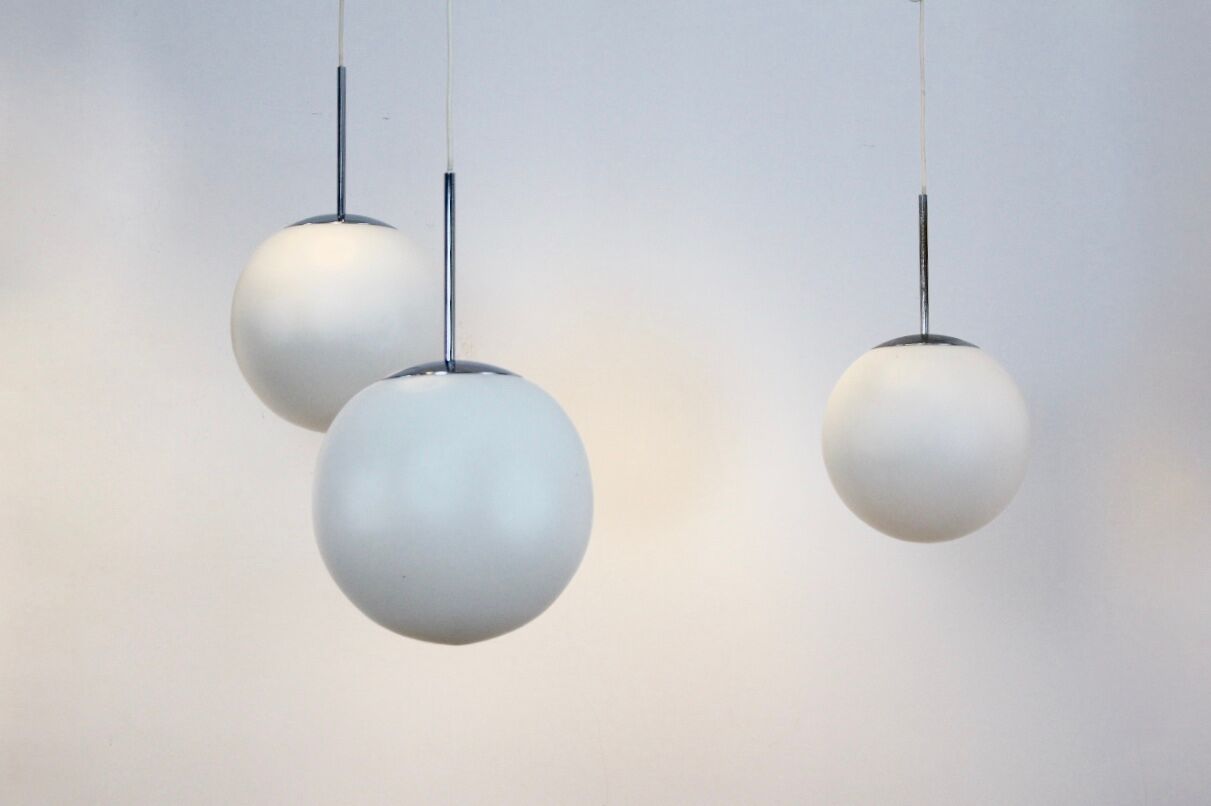 One of Twenty Chrome and Opal Glass Bubble Pendants by Peill & Putzler, designed by Wilhelm Wagenfeld