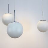 One of Twenty Chrome and Opal Glass Bubble Pendants by Peill & Putzler, designed by Wilhelm Wagenfeld