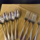 Series of 4 silver metal cutlery uniplat net model spoons forks