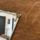 Wall-mounted wardrobe with 4 hooks in wood and aluminum with beveled trapezoid mirror