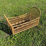 Children's bed in vintage rattan
