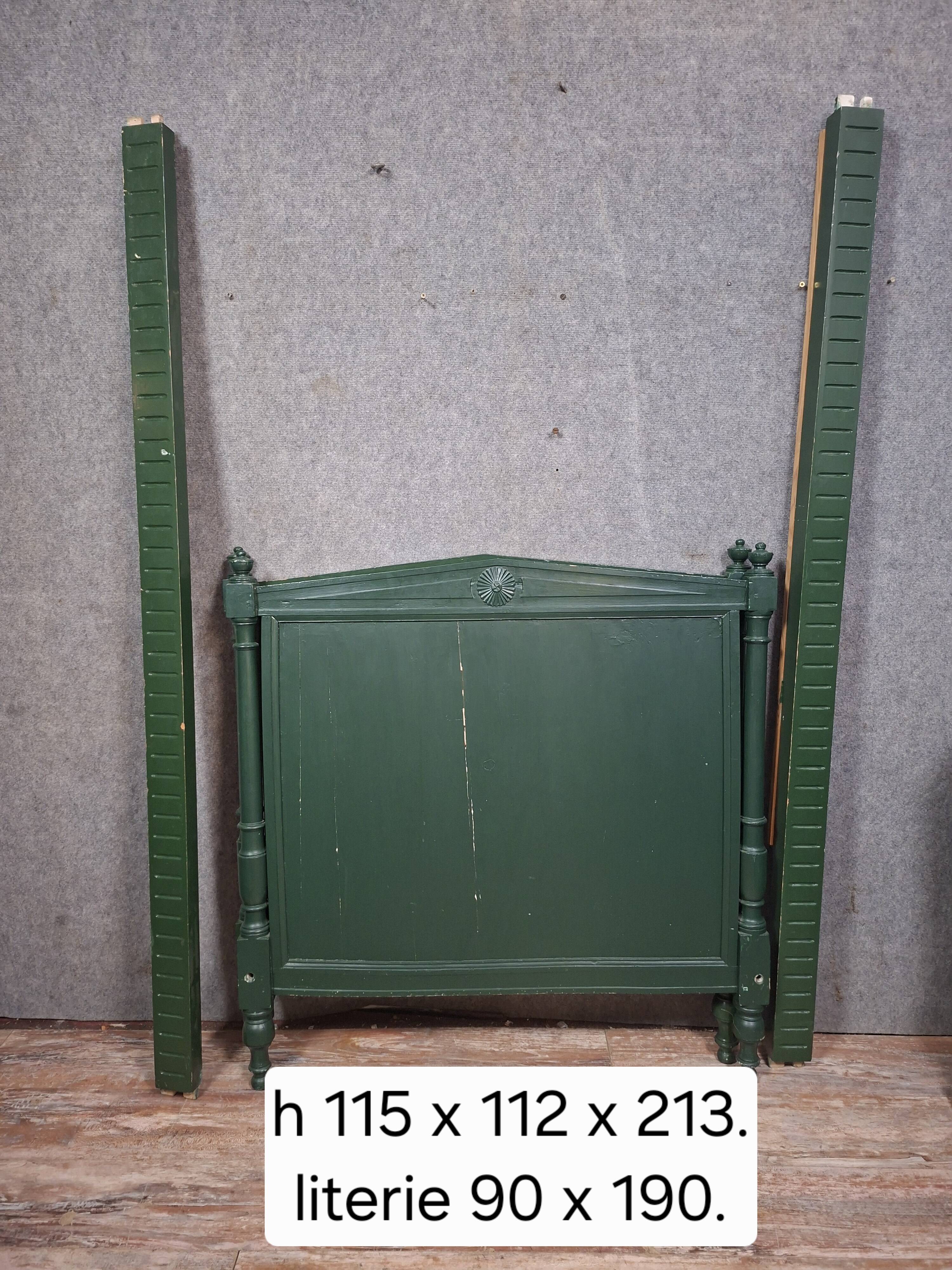 Directoire style bed in painted green wood.