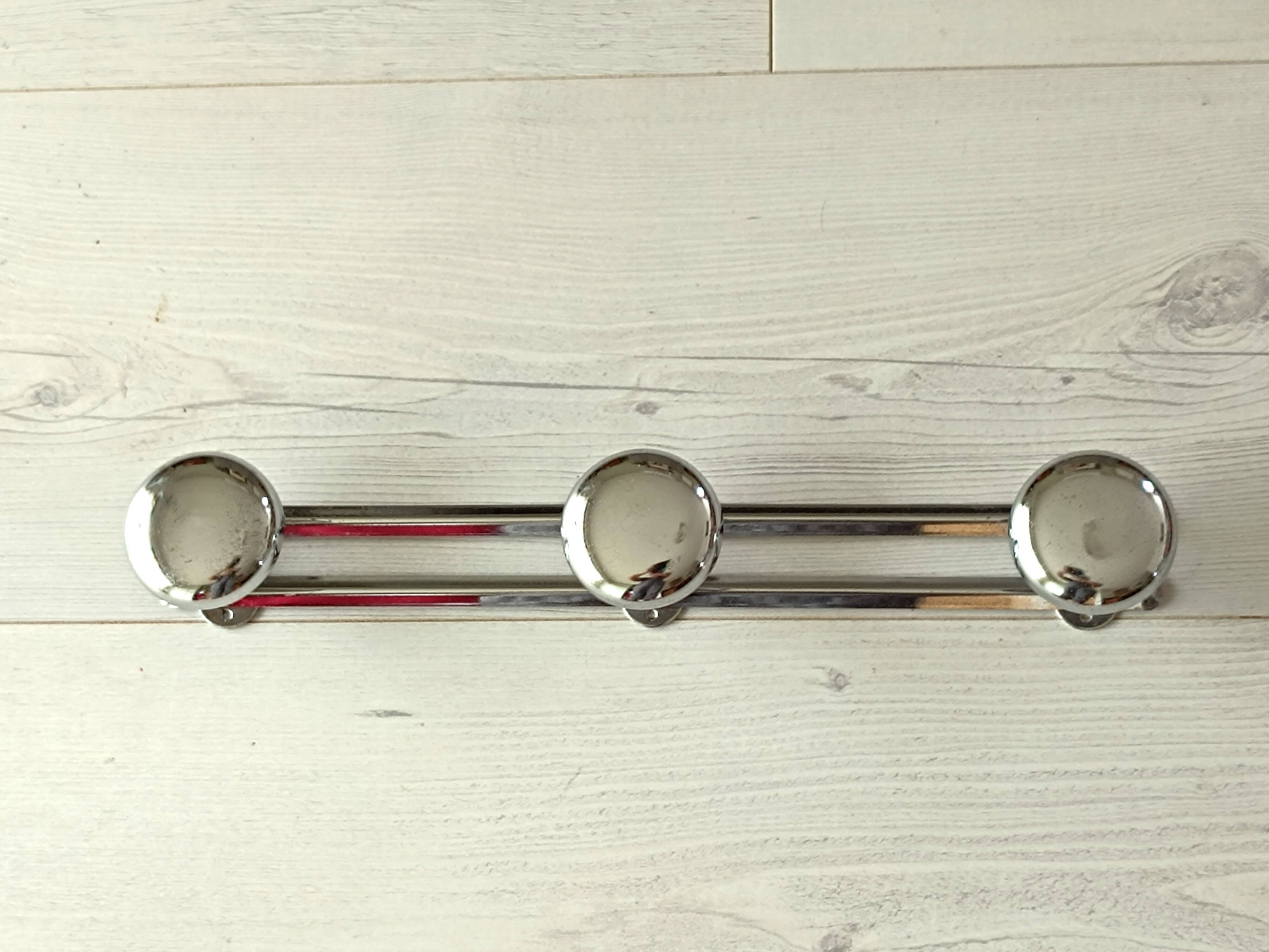Chrome metal wall coat rack