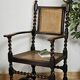 Paire de fauteuils canneés style Louis XIII anciens